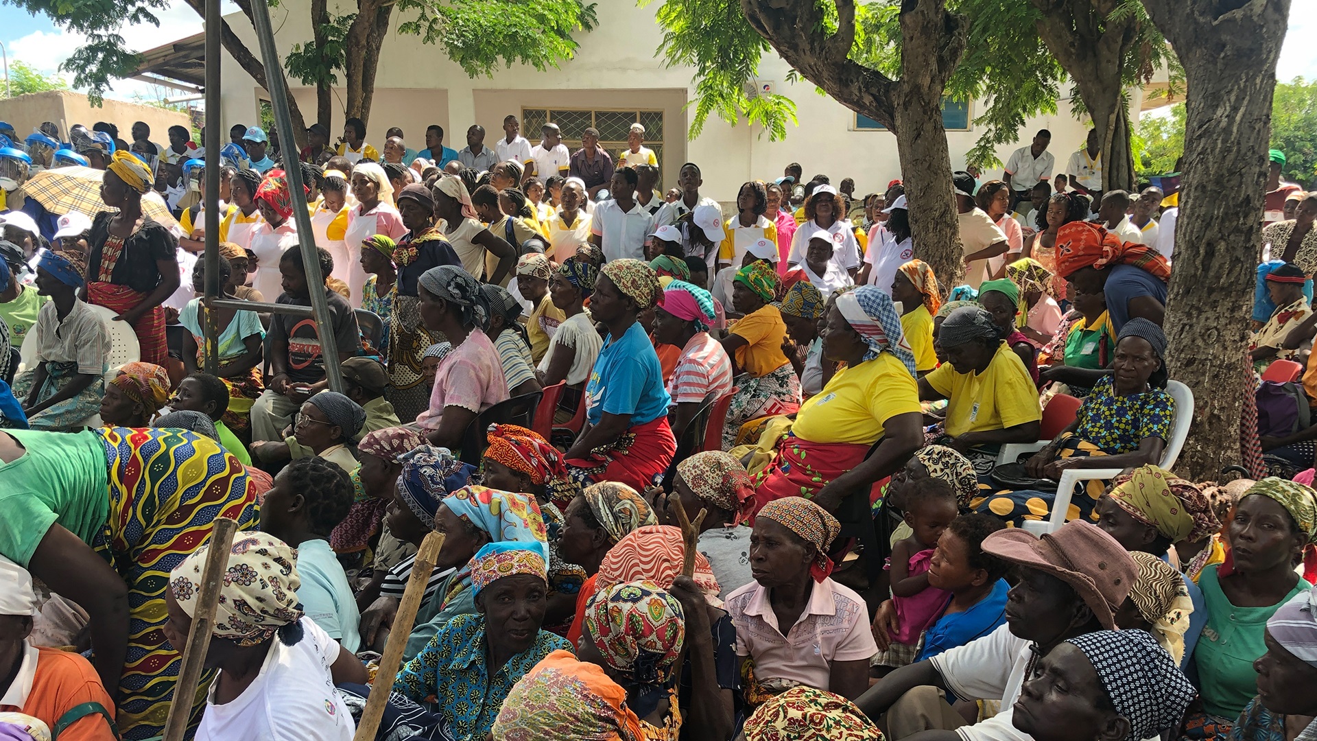 Photo of a community gathering outside to watch an event on World Malaria Day 2019 in Nhamatanda, Mozambique.