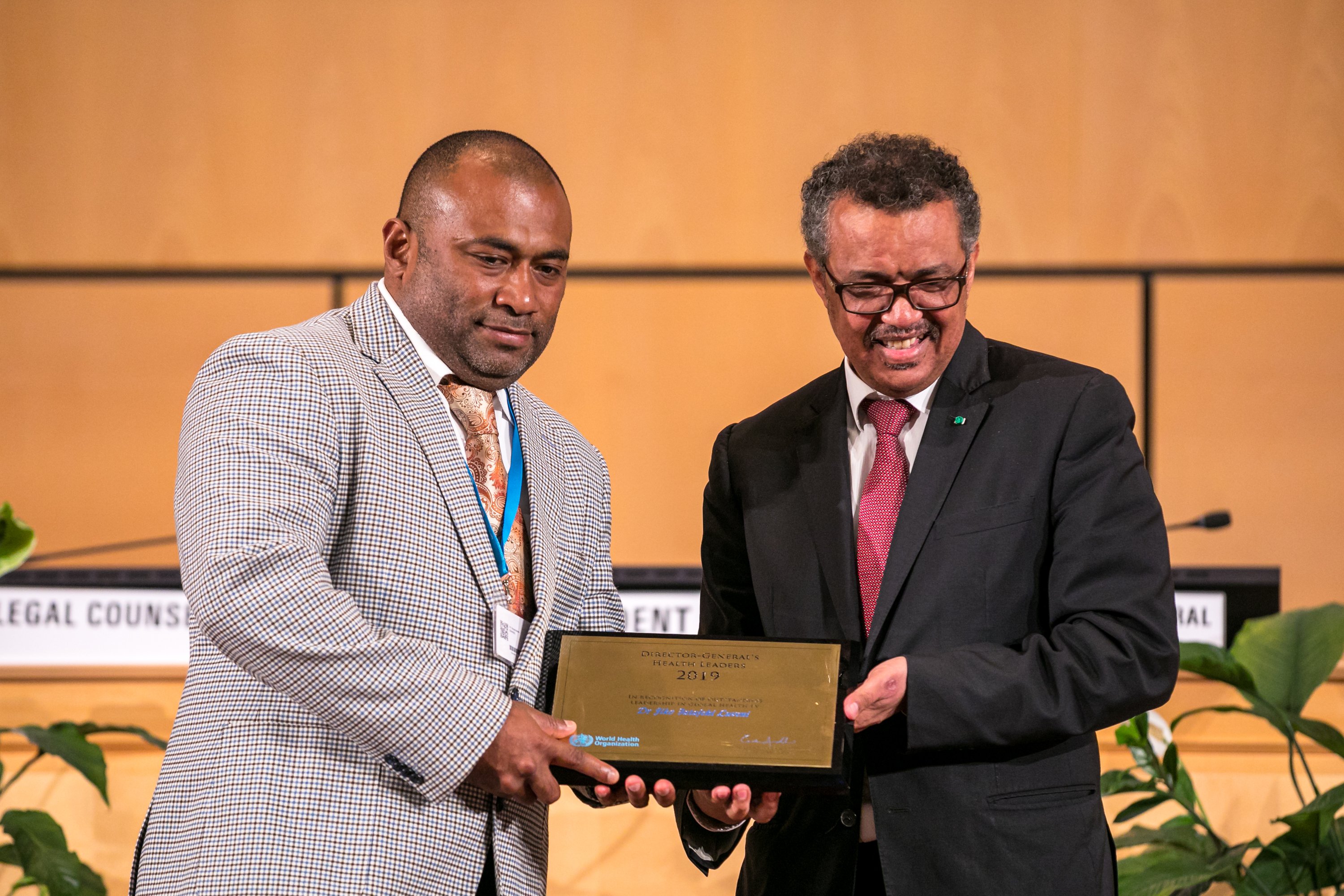 Fiji's Minister of Health & Medical Services receiving the award on Dr Luveni’s behalf from WHO Director General Dr Tedros Ghebreyesus